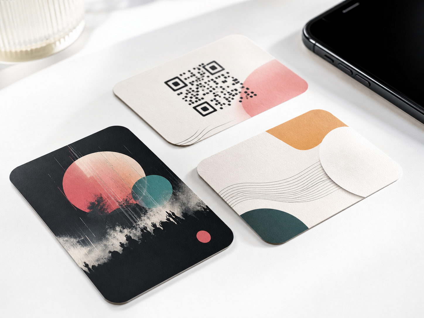 Printed cards suggesting release assets, QR links and wallet passes.